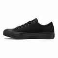 Side view of all-black low-top sneaker